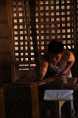 As a final step, finished T'nalak cloths are polished by rubbing a cowrie shell onto the surface of the cloth.